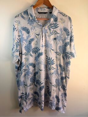 Travis Mathew Light Blue Floral Polo with Navy Leaf Print